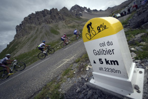 Chasers climb past a Galibier (2.556 m) milepost in the109,5 km and nineteenth stage of the 2011 Tour de France cycling race run between Modane Valfrejus and Alpe d'Huez ski resort, southeastern France, on July 22 , 2011.  AFP PHOTO / LIONEL BONAVENTURE (Photo credit should read LIONEL BONAVENTURE/AFP/Getty Images)